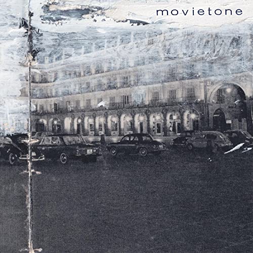 Vinyl record cover: grayscale image of a building and classic cars.