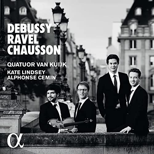 Black and white photo of four musicians with a violin, city background.