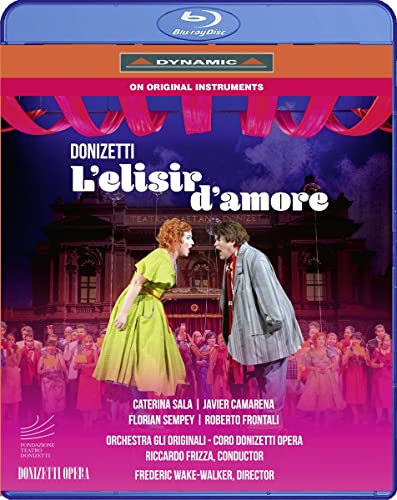 Blu-ray cover for Donizetti’s opera “L’elisir D’amore” with performers and building.