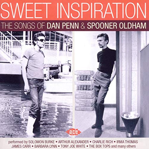 CD cover featuring two men walking beside a building and text details.