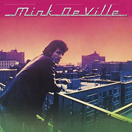Album cover for Mink Deville’s “Return To Magenta” with a man overlooking a city.