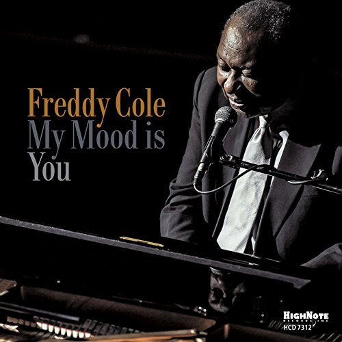 Freddy Cole at a piano with microphone, album cover for "My Mood is You".