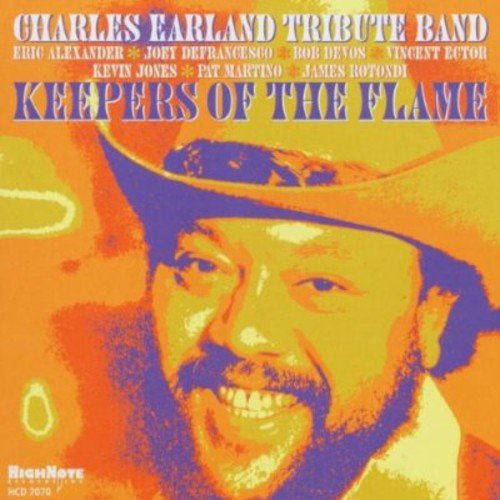 CD cover featuring a smiling man in a cowboy hat, text details.