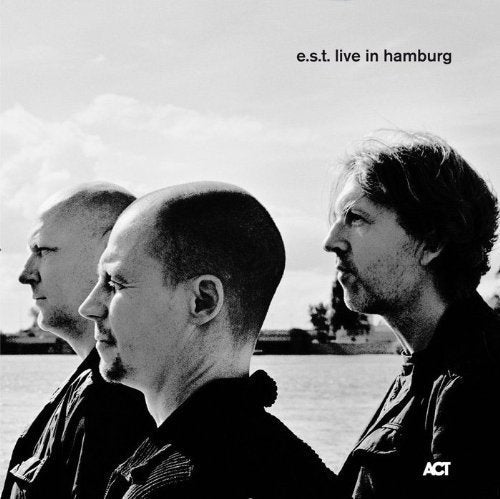 Black and white album cover featuring three men in profile.