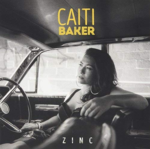 Caiti Baker album cover, “Zinc”, featuring a woman by a car window.