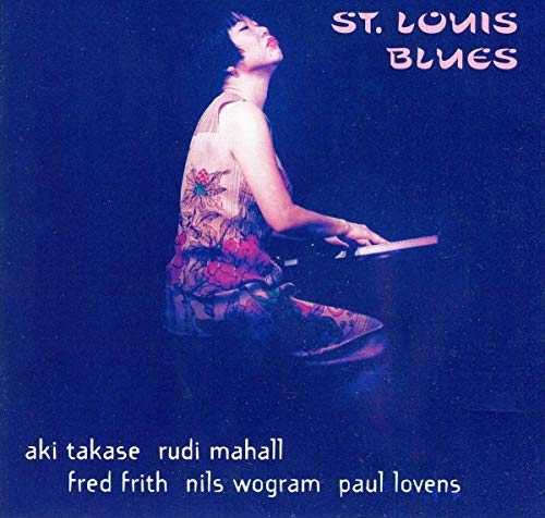 CD cover: Aki Takase at a piano, floral dress, blue background.