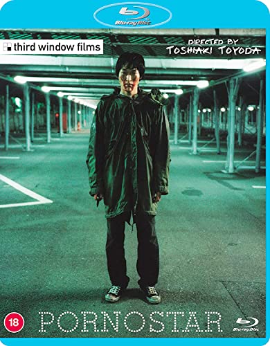Blu-ray cover: man in a hooded jacket standing in a parking garage.