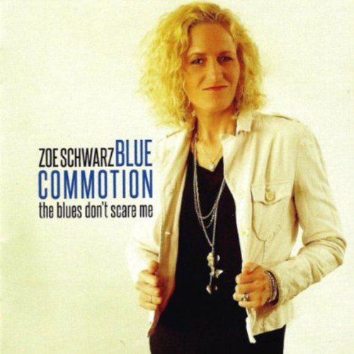 Woman with curly hair, wearing a jacket and necklaces, album cover.