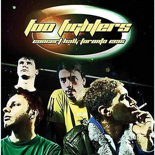 Foo Fighters album cover featuring band members in a dark setting.