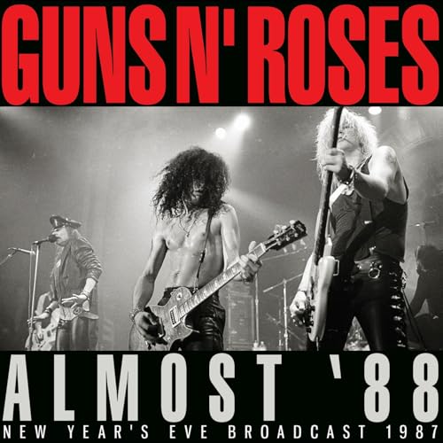 Guns N' Roses band members performing live in black and white.