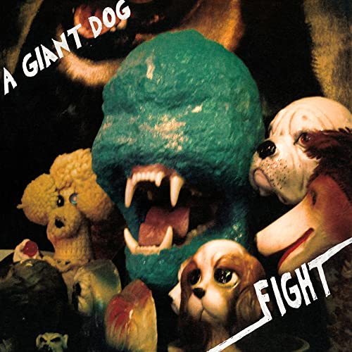 A central teal monster head surrounded by various dog figurines against a dark background.