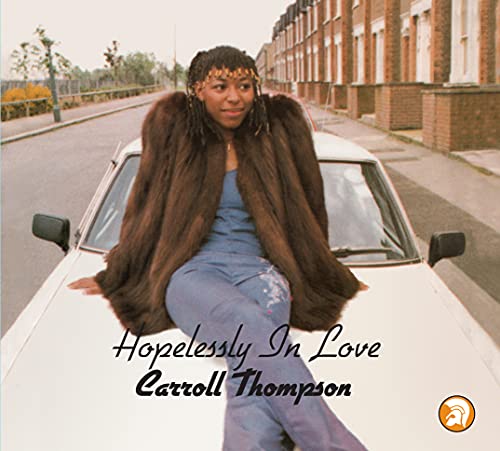 Carroll Thompson album cover: woman with afro posing by a car.