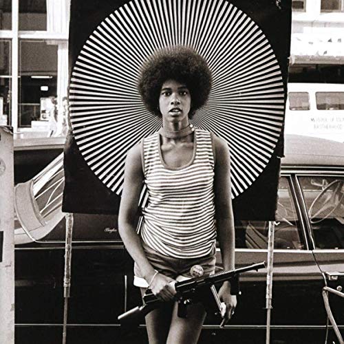 Black and white album cover featuring a man with an afro and a rifle.