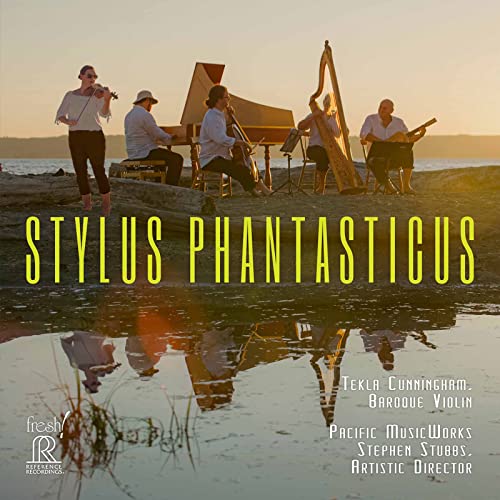 CD cover with musicians performing outdoors, reflected in water.