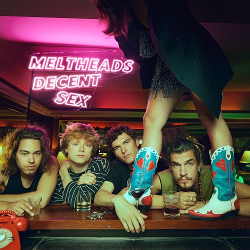 Band portrait with neon sign reading “Meltheads Decent Sex” above them.