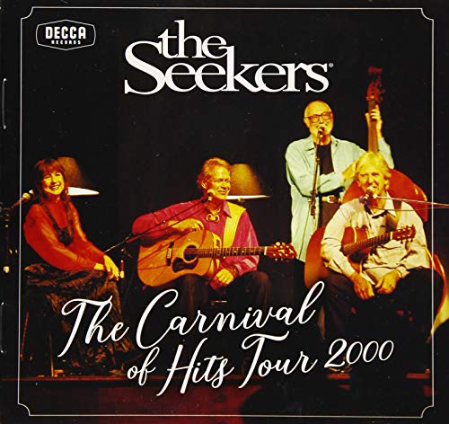 The Seekers band members performing with guitars on a stage.