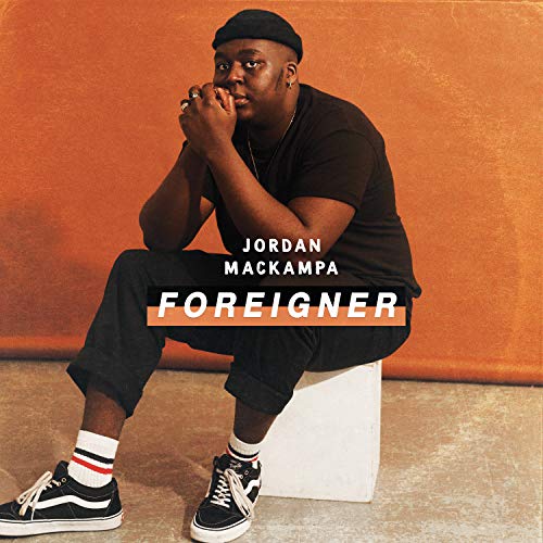 Album cover for Jordan Mackampa’s “Foreigner” featuring a portrait of the artist.
