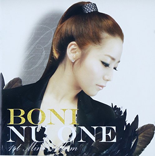 CD cover featuring a woman with long hair and feather details.