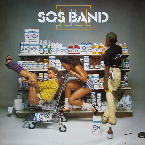 S.O.S. Band album cover featuring people in a supermarket setting.