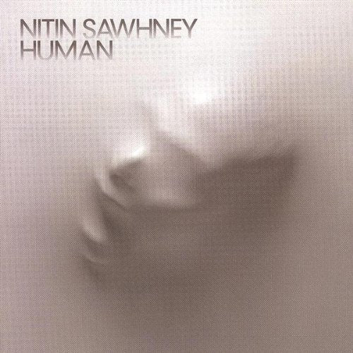 CD cover for Nitin Sawhney’s “Human” with a blurred face portrait.