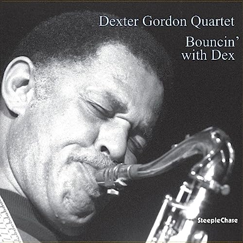 Black and white portrait of Dexter Gordon playing a saxophone, vinyl record.