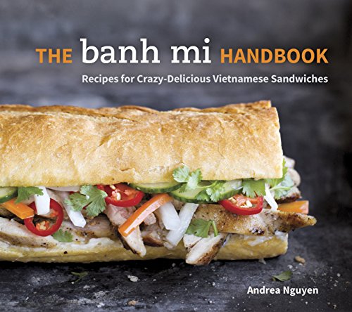 Cookbook cover featuring a large, filled Vietnamese banh mi sandwich.