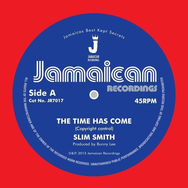 Blue vinyl record label with “Slim Smith” and “The Time Has Come” text.