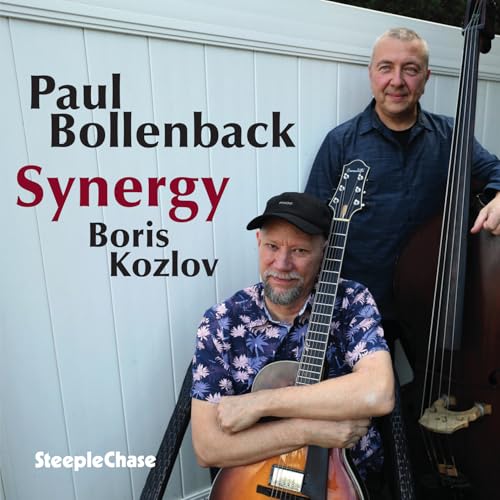 CD cover featuring two smiling musicians with a guitar and bass.