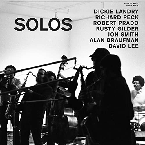 Black and white vinyl record cover featuring musicians and the title "SOLOS".