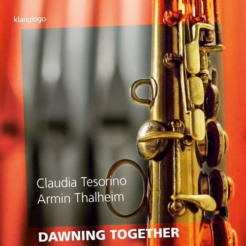 CD cover featuring a saxophone and blurred organ pipes, red and gold tones.