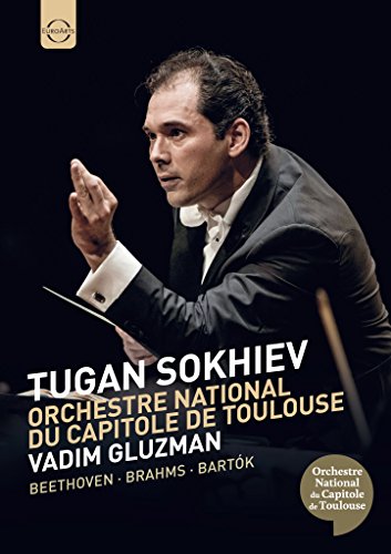 Conductor Tugan Sokhiev leading an orchestra, DVD cover art.