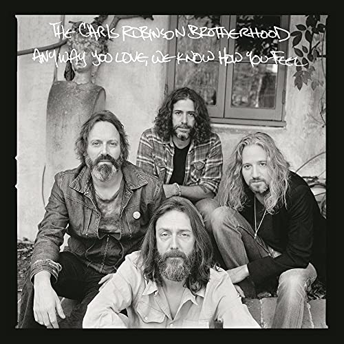 Black and white album cover featuring four bearded men posing outdoors.