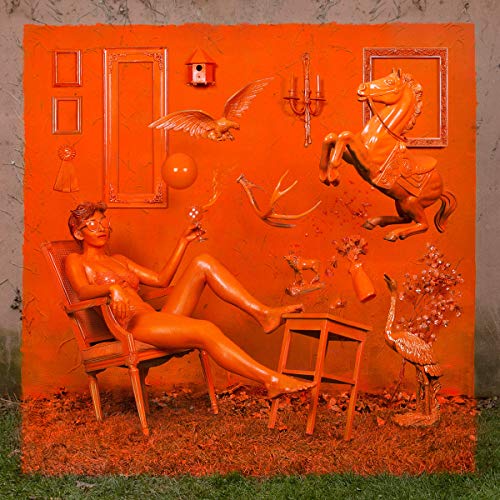 Orange album cover featuring a reclining figure and surreal objects.