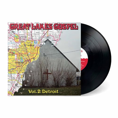 Vinyl record and album cover featuring a barn with a cross.