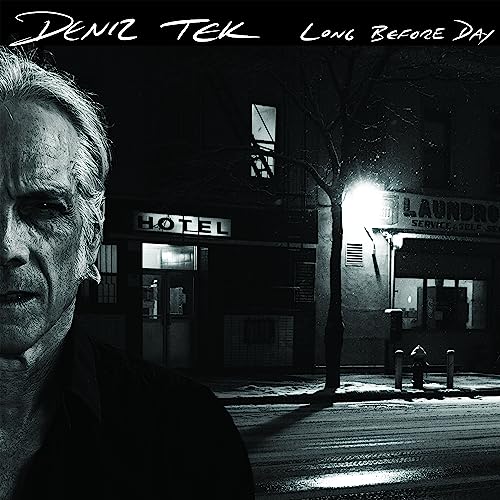 Black and white album cover featuring a man’s face and a nighttime street scene.