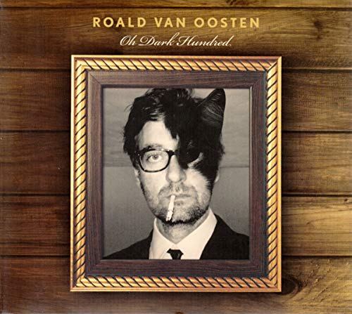 CD cover: Man with cat features in a decorative frame.
