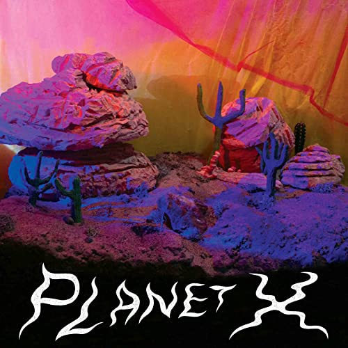 Album cover for Red Ribbon’s “Planet X” featuring a desert landscape.