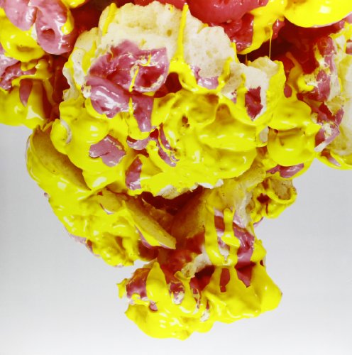 Abstract paint splatters in red, yellow, and white, close-up view.