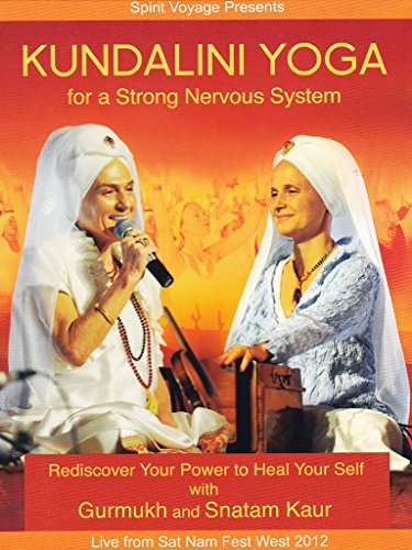 Two women in white head coverings performing Kundalini yoga on an orange background.
