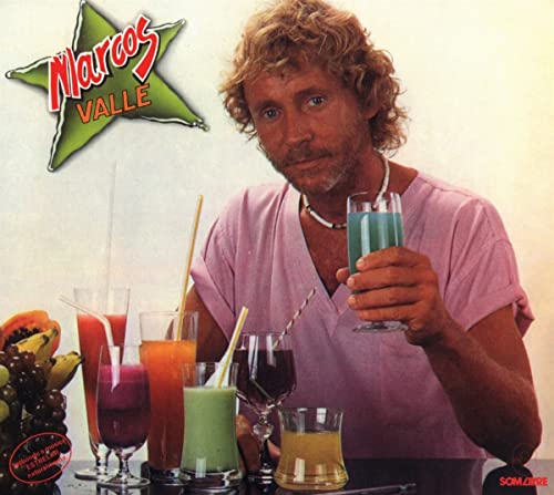 Marcos Valle album cover with artist holding a blue drink, fruit nearby.
