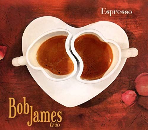 Two heart-shaped espresso cups on a heart-shaped saucer against a textured red background.