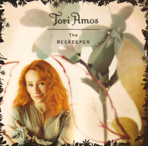 Tori Amos album cover, "The Beekeeper," featuring a portrait and flowers.