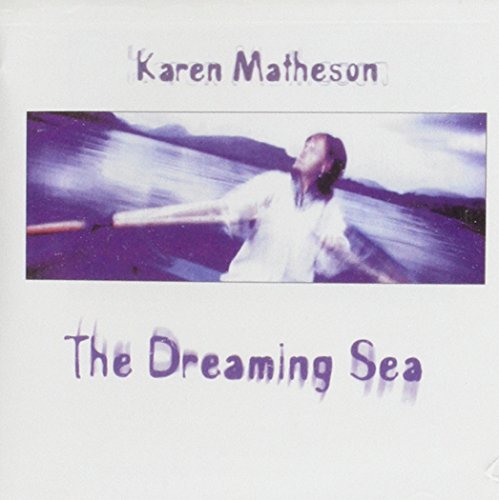 CD cover: woman rowing a boat on a blurred, purple sea.