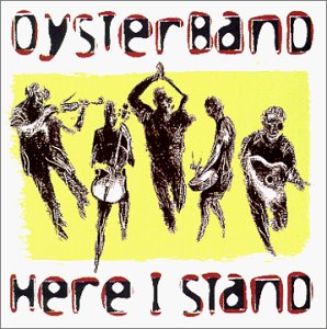 Oysterband album cover: silhouetted musicians on yellow background, text reads "Here I Stand".