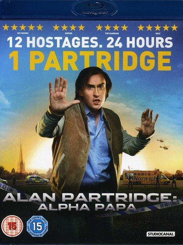 Alan Partridge in a brown jacket, hands raised, with police and helicopters.