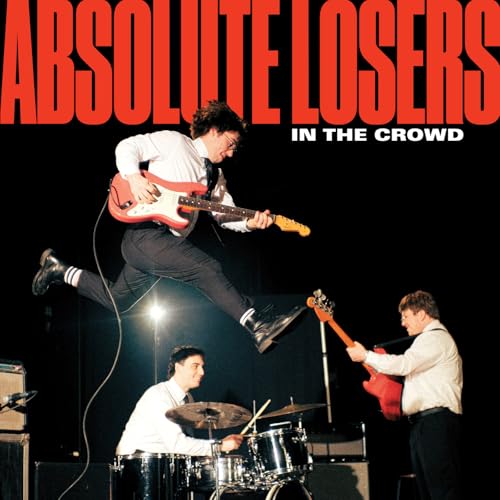 Album cover: band performing with guitarist jumping in mid-air.