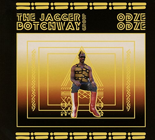 CD cover: Man with mohawk in patterned outfit, geometric background.