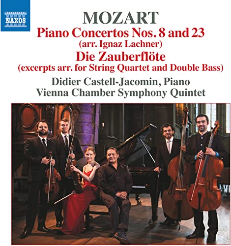 Classical musicians posing with instruments before a grand piano.