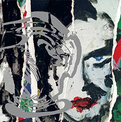 Album cover for The Cure’s “Torn Down,” featuring a distressed portrait.