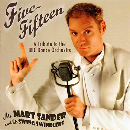 CD cover featuring a man with a microphone and raised finger.